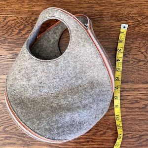 Asymmetric felted wool handbag